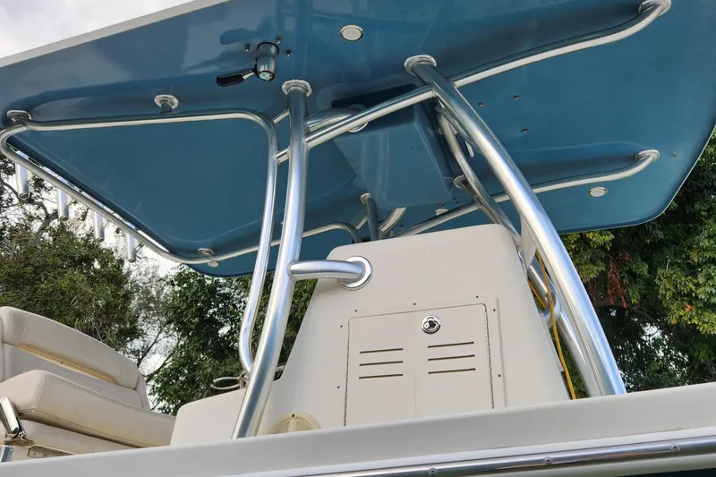Slide: The Image of 2013 Panga Center Console boat with blue T-top and stainless steel frame. - 9