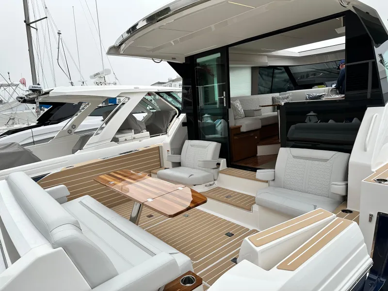 Slide: The Image of Luxurious 2024 Tiara Yachts 48 LE with spacious seating and elegant interior design. - 10