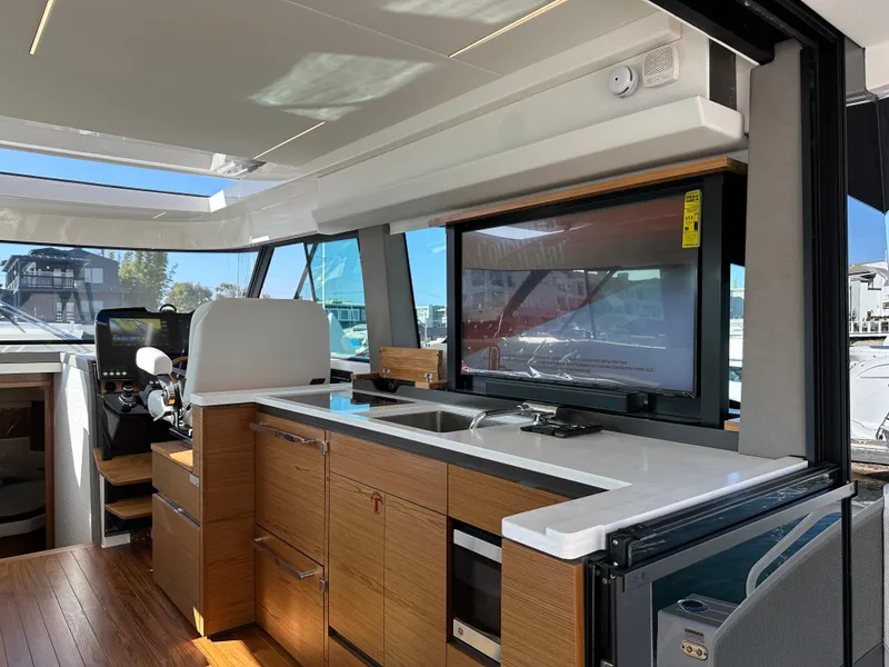 Slide: The Image of 2024 Tiara Yachts 48 LE interior with modern kitchen and sleek design. - 41