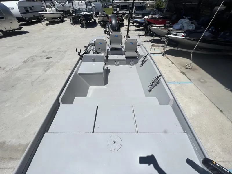 Slide: The Image of 2021 Southfork 20X72 boat in a dealership lot with other boats and RVs. - 11