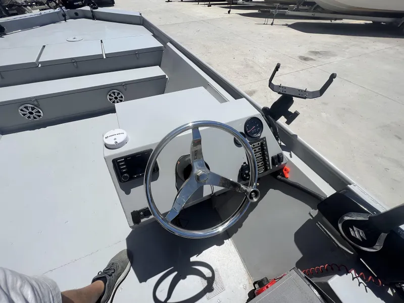 Slide: The Image of 2021 Southfork 20X72 boat dashboard with steering wheel and control panel. - 12