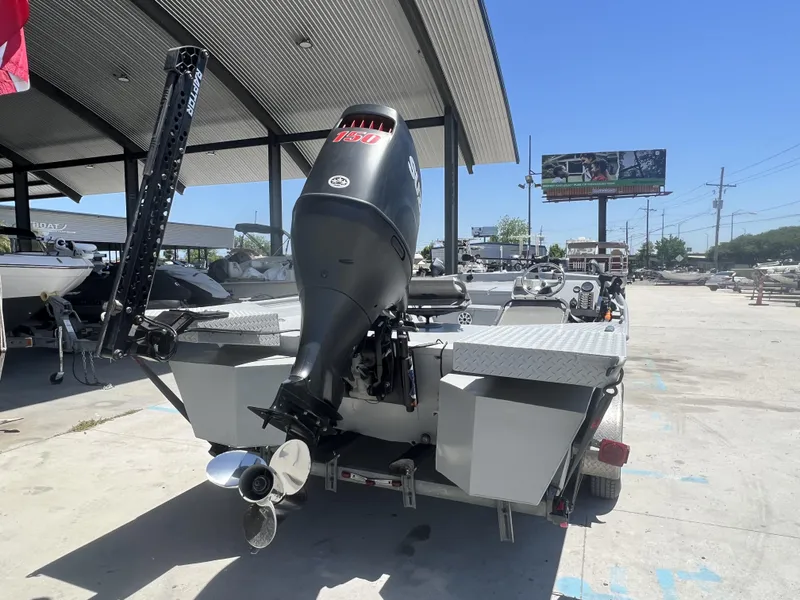 Slide: The Image of 2021 Southfork 20X72 boat with 150 HP motor at a dealership. - 2