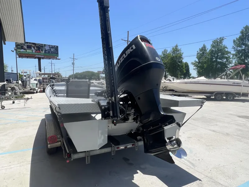 Slide: The Image of 2021 Southfork 20X72 boat with Suzuki outboard motor on trailer. - 3