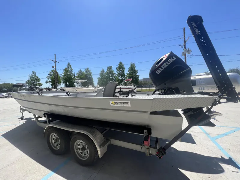 Slide: The Image of 2021 Southfork 20X72 boat with Suzuki outboard motor on a trailer. - 4