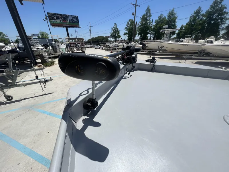 Slide: The Image of 2021 Southfork 20X72 boat with Minn Kota trolling motor in a boatyard. - 7