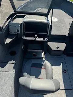 Slide: The Image of 2024 Tracker Pro Guide V-175 WT boat interior with seating and console. - 16