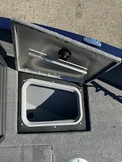 Slide: The Image of 2024 Tracker Pro Guide V-175 WT boat storage compartment, open lid view. - 5