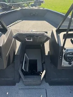 Slide: The Image of 2024 Tracker Pro Guide V-175 WT boat interior with open storage compartment. - 6