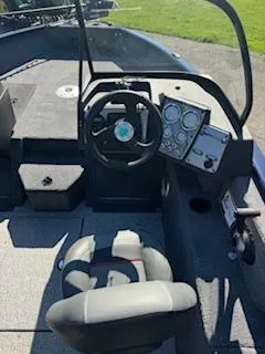 Slide: The Image of 2024 Tracker Pro Guide V-175 WT boat interior with steering wheel and dashboard controls. - 7