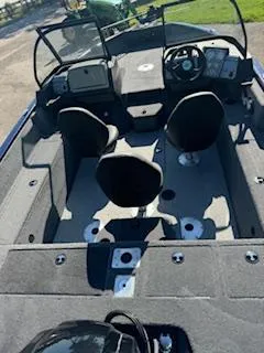 Slide: The Image of 2024 Tracker Pro Guide V-175 WT fishing boat interior with seating and dashboard. - 9