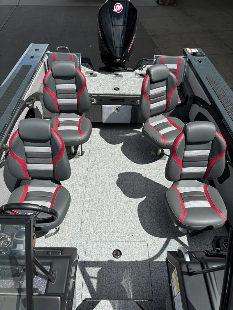 Slide: The Image of 2024 Ranger VX1988 WT boat interior with four seats and a motor. - 4