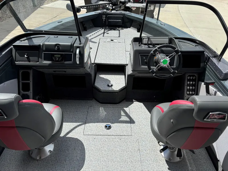 Slide: The Image of 2024 Ranger VX1988 WT boat interior with dual seats and modern dashboard. - 5