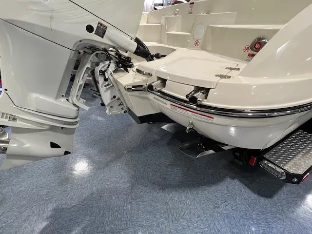 Slide: The Image of 2024 Stingray 230SX boat stern and outboard motor on display. - 4