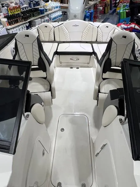 Slide: The Image of 2024 Stingray 230SX boat interior with luxurious seating and modern design. - 6
