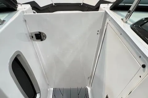 Slide: The Image of 2024 Monterey 278SS boat interior with white panel and storage compartments. - 4