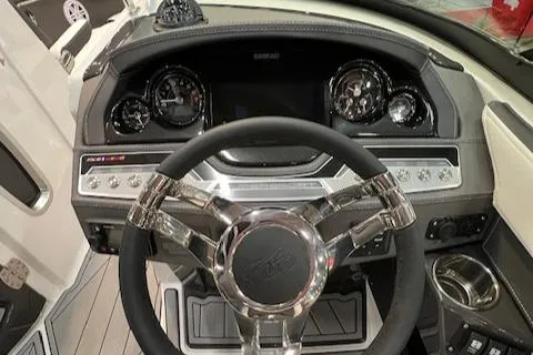 Slide: The Image of 2024 Monterey 278SS boat dashboard with steering wheel and instrument panel. - 7
