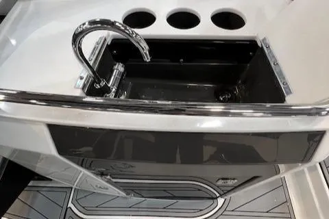 Slide: The Image of 2024 Monterey 278SS boat sink and faucet in cockpit area. - 8