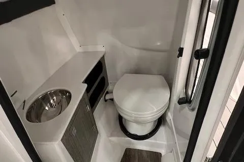 Slide: The Image of 2024 Monterey 278SS boat bathroom with toilet and sink. - 9