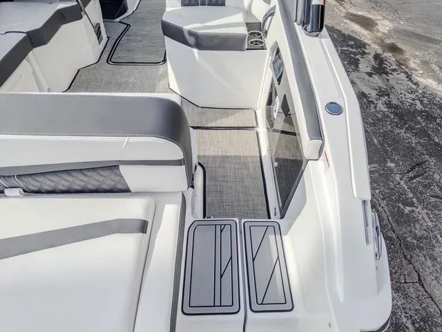 Slide: The Image of 2024 Monterey 258 SS boat interior with sleek seating and modern design. - 14