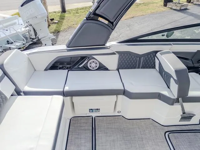 Slide: The Image of 2024 Monterey 258 SS boat interior with sleek seating and modern design. - 19