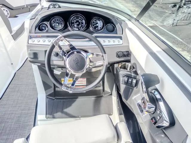 Slide: The Image of 2024 Monterey 258 SS boat dashboard with modern steering and controls. - 22