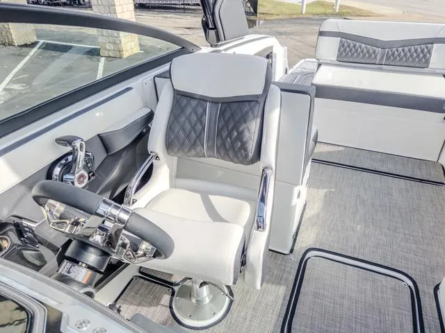 Slide: The Image of 2024 Monterey 258 SS boat interior with luxurious seating and modern steering wheel. - 23