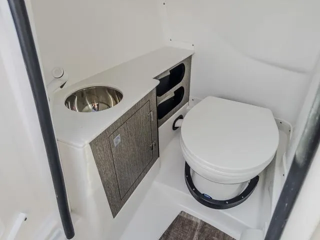 Slide: The Image of 2024 Monterey 258 SS boat bathroom with sink and toilet. - 28