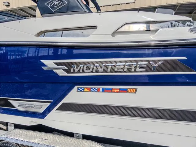 Slide: The Image of 2024 Monterey 258 SS boat with nautical flags and sleek design. - 5