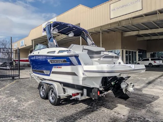 Slide: The Image of 2024 Monterey 258 SS boat on trailer outside dealership. - 6