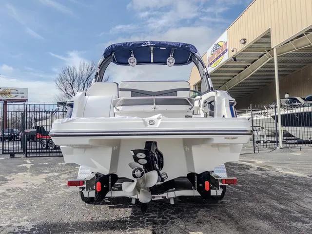 Slide: The Image of 2024 Monterey 258 SS boat, rear view, parked outdoors. - 7
