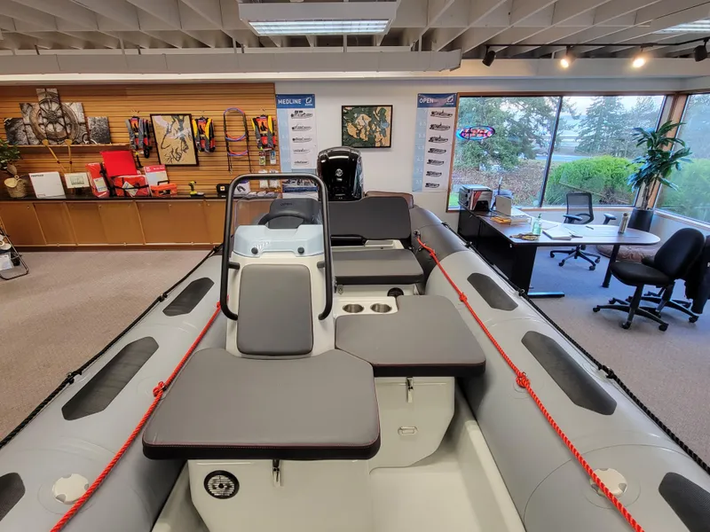 Slide: The Image of 2024 Zodiac Open 4.8 inflatable boat displayed in showroom. - 9