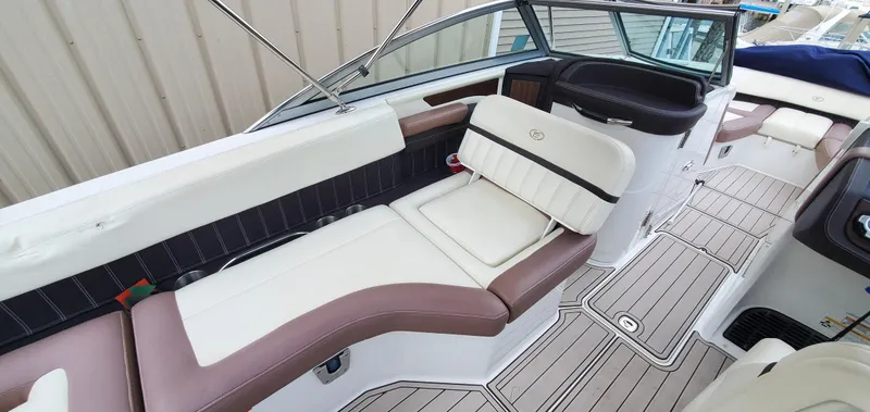 Slide: The Image of 2013 Cobalt 24SD boat interior with luxurious seating and modern design. - 26