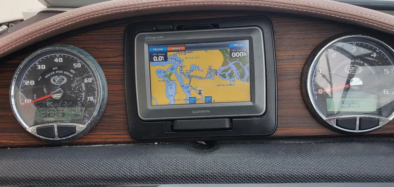 Slide: The Image of Dashboard of a 2013 Cobalt 24SD boat with GPS and gauges. - 33