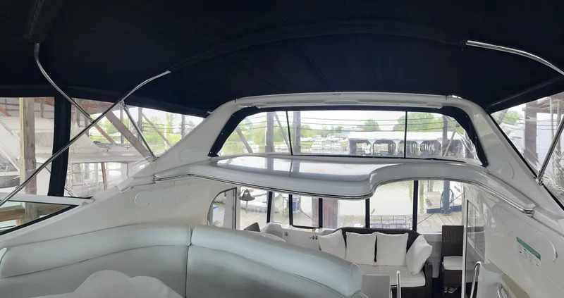 Slide: The Image of 2002 Carver 466 Motor Yacht interior with seating and panoramic windows. - 33