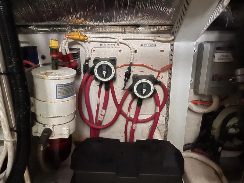 Slide: The Image of Engine room of 2002 Carver 466 Motor Yacht with wiring and control panels. - 36