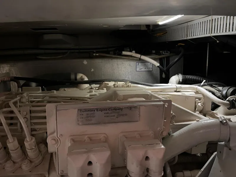 Slide: The Image of Engine room of a 2002 Carver 466 Motor Yacht featuring a Cummins engine. - 38