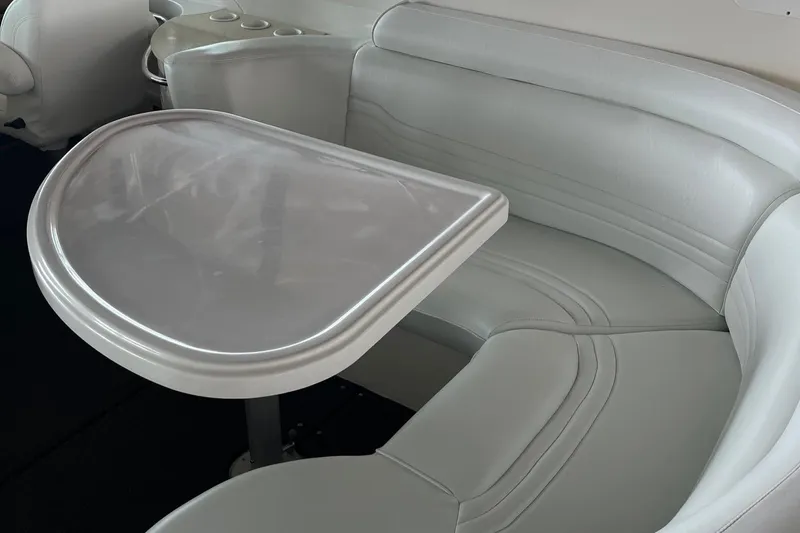 Slide: The Image of 2002 Carver 466 Motor Yacht interior with sleek gray seating and table. - 40