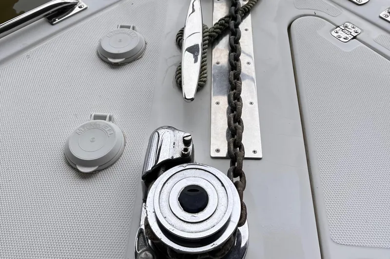 Slide: The Image of Deck of 2002 Carver 466 Motor Yacht with anchor chain and winch. - 9