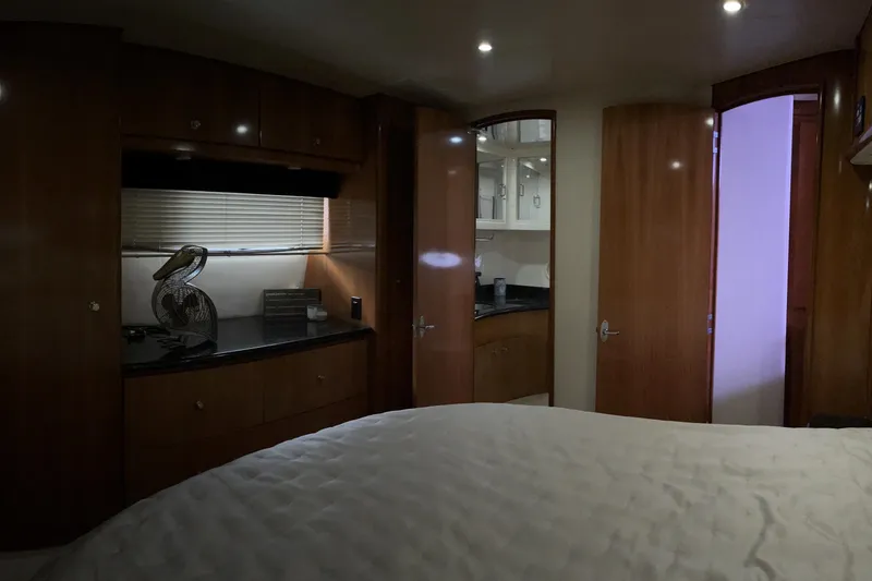 Slide: The Image of Interior of 2002 Carver 466 Motor Yacht with wood cabinetry and cozy bedroom. - 27