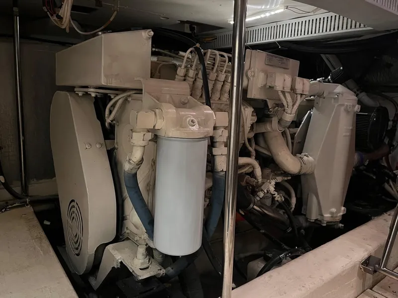 Slide: The Image of Engine room of a 2002 Carver 466 Motor Yacht, showcasing mechanical components and systems. - 34