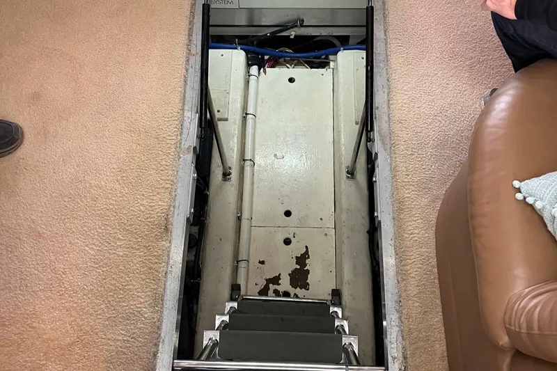 Slide: The Image of Engine room access hatch on 2002 Carver 466 Motor Yacht, showing steps and interior. - 41