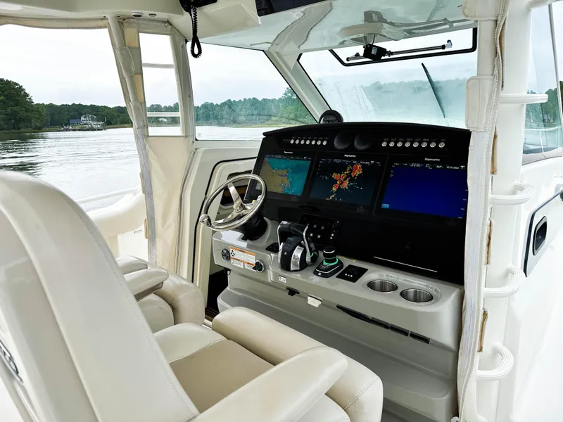 Slide: The Image of 2017 Boston Whaler 420 Outrage helm with advanced navigation displays and comfortable seating. - 33