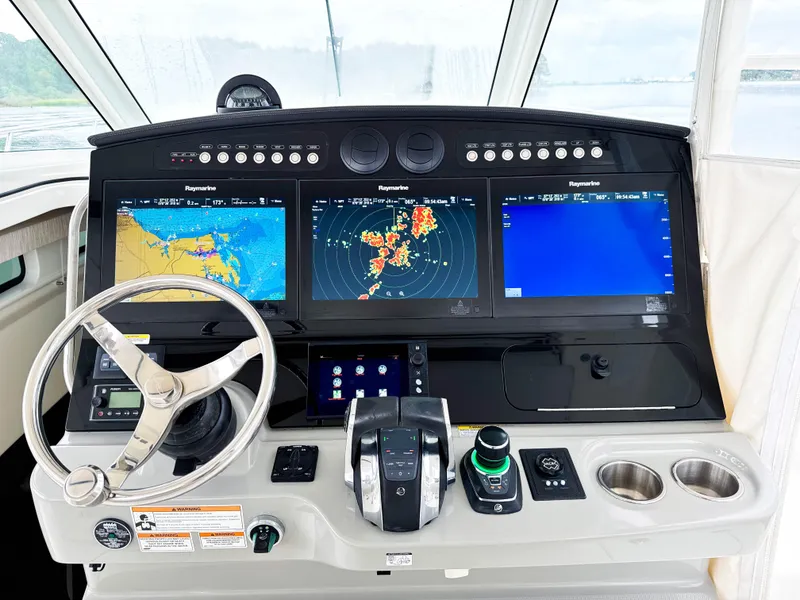 Slide: The Image of 2017 Boston Whaler 420 Outrage helm with advanced navigation displays and controls. - 34