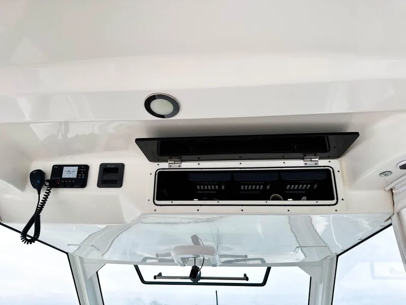 Slide: The Image of 2017 Boston Whaler 420 Outrage helm electronics and communication equipment. - 39