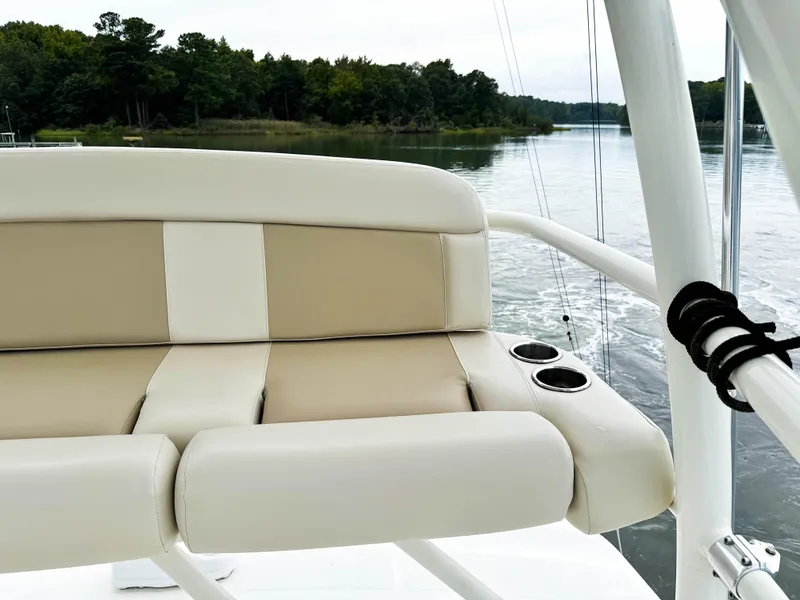Slide: The Image of Boston Whaler 420 Outrage 2017 boat seat with cup holders on a calm river. - 44