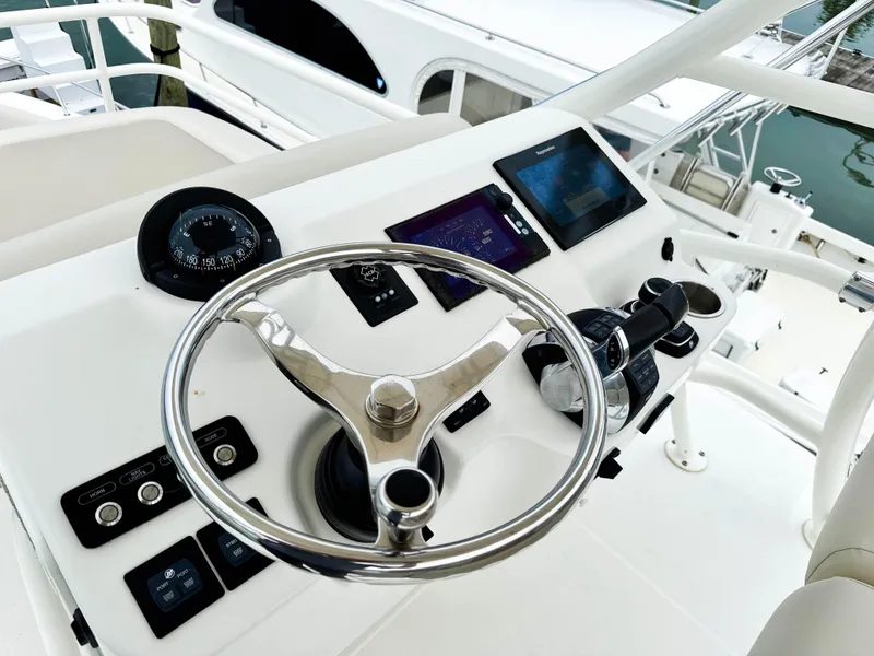 Slide: The Image of Steering console of 2017 Boston Whaler 420 Outrage with modern navigation equipment. - 45