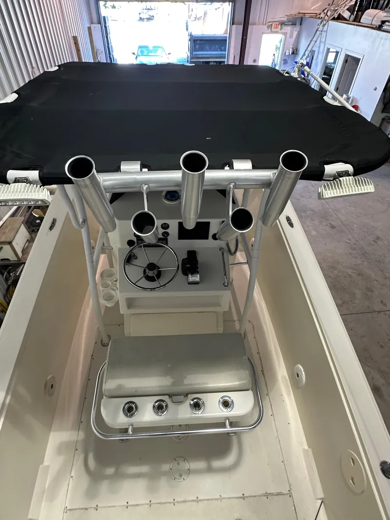 Slide: The Image of 1974 Donzi Center Console boat with black canopy and fishing rod holders. - 4