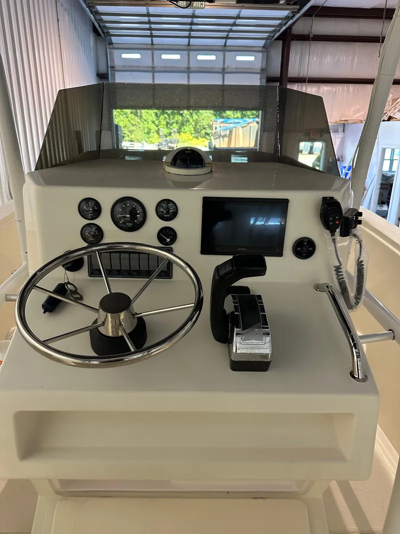 Slide: The Image of 1974 Donzi Center Console boat dashboard with steering wheel and controls. - 5