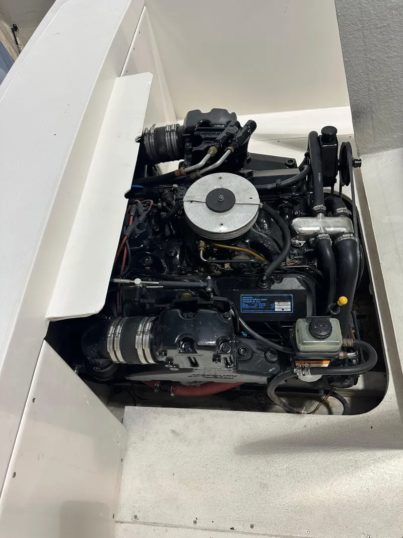 Slide: The Image of 1974 Donzi Center Console engine compartment with visible components and wiring. - 6