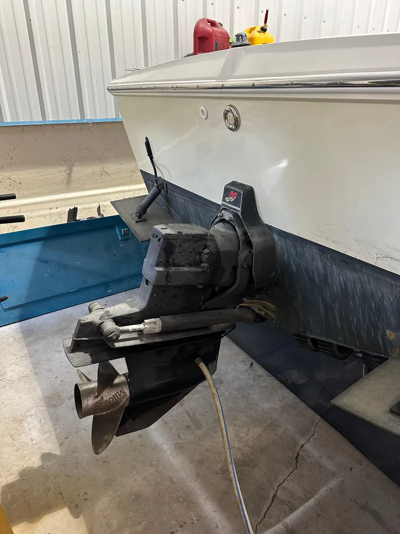 Slide: The Image of 1974 Donzi Center Console boat with outboard motor in a garage. - 7